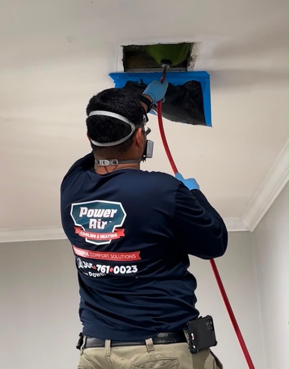 Power Air technician performing professional duct cleaning